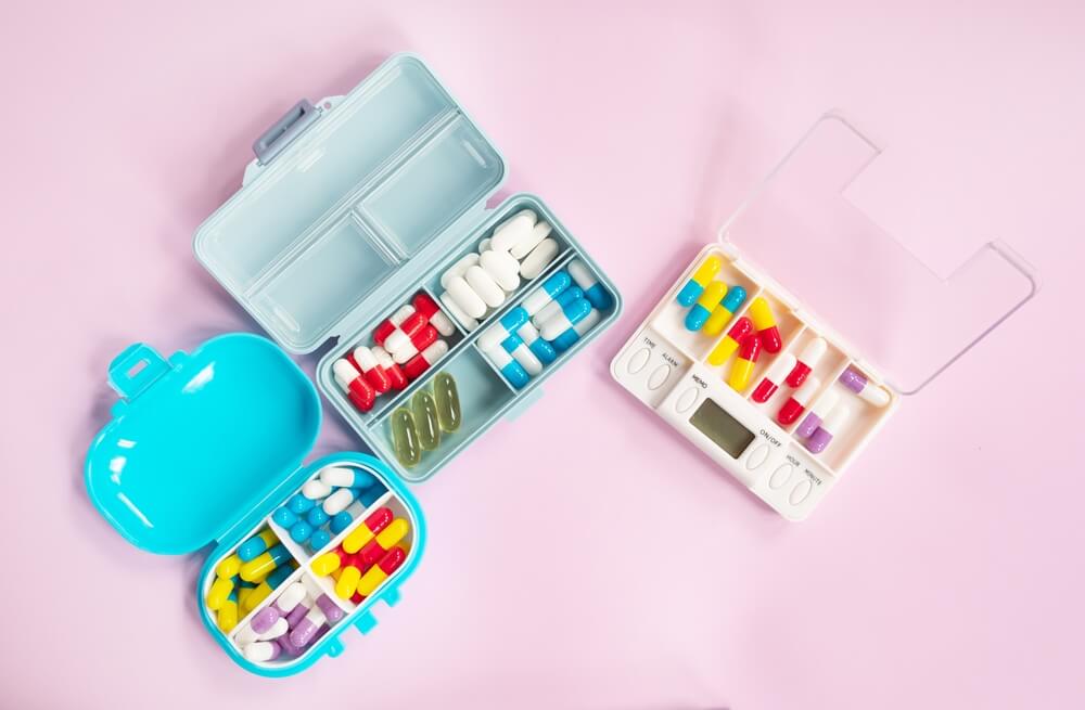 various types of pill organisers showing the benefits of storing medication ready to take later